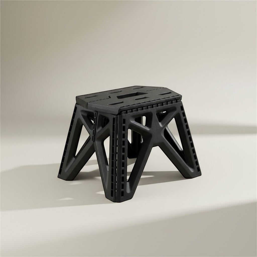 CAMPY black heavy-duty folding plastic camping stool, perfect for outdoor use, fishing, and travel.